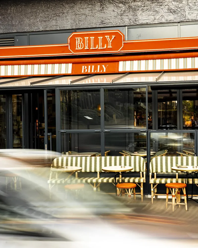 Billy’s frontage and terrace beneath the orange-and-white striped awning