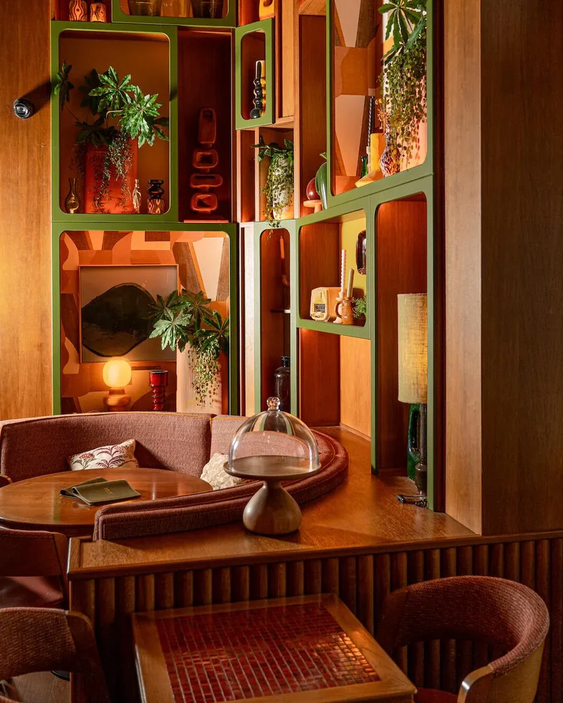 Billy’s banquettes and shelves in a warm light
