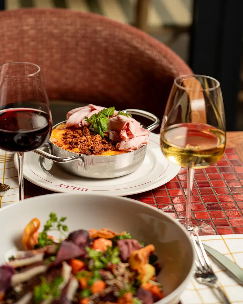 Plates and glasses on a table at Billy brasserie